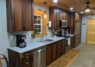 Kitchen with dark wood cabinets.