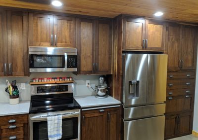 Kitchen with dark wood cabinets.
